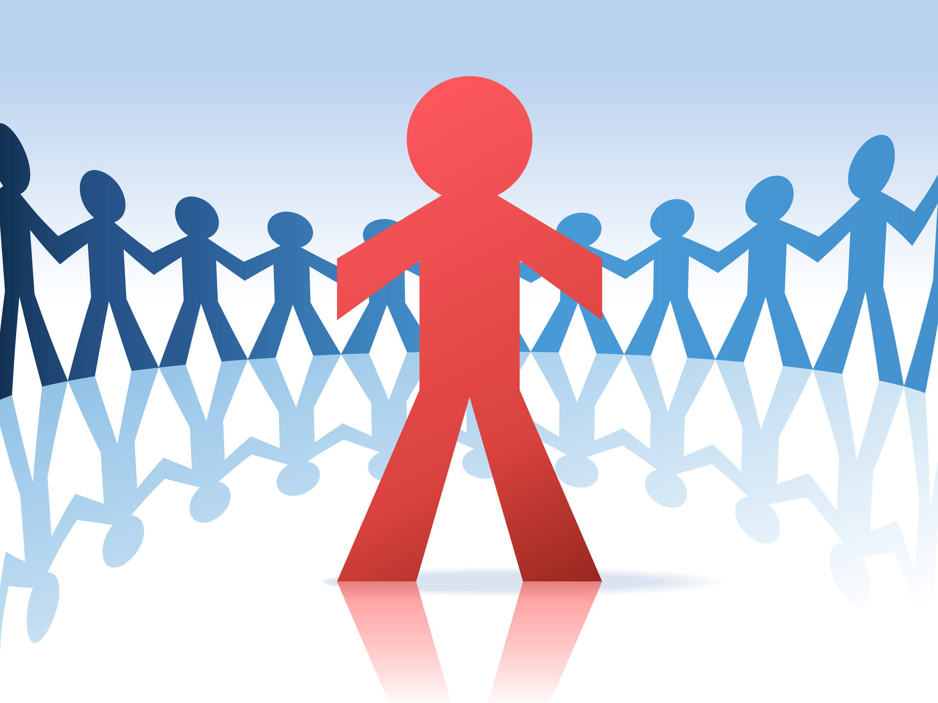 A picture of a group of blue paper men standing in a circle around one red paper man, representing independence.