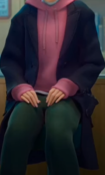A picture of someone wearing a pink hoodie with a black blazer over it.