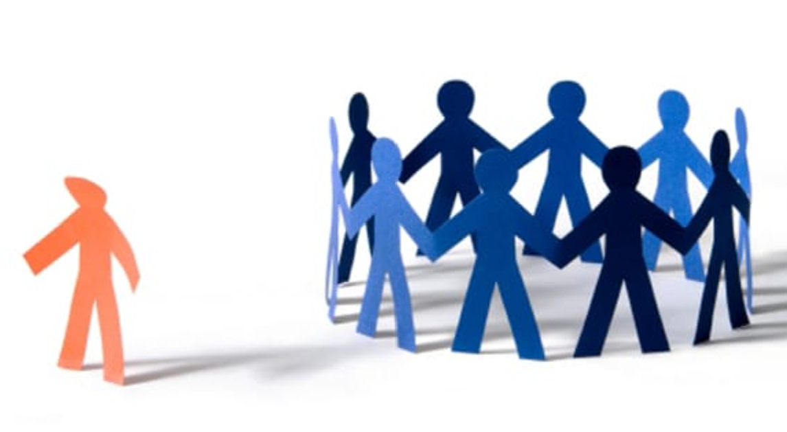 A group of people on the right side, but one is left out alone on the left side, depicting being forgotten.